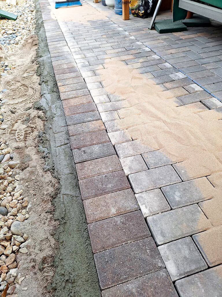 Polymeric sand finish